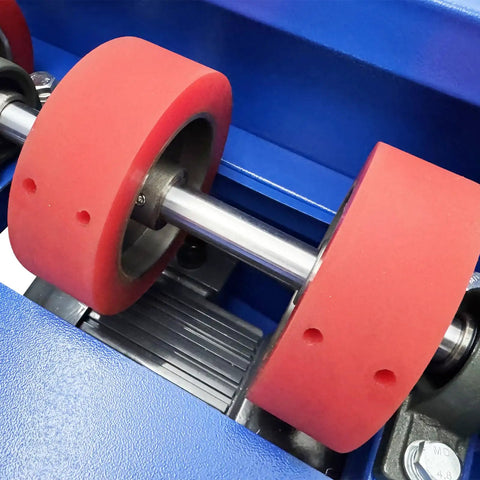 Close-up of Heavy Hitter 110 Volt Electric Drum Rotator Mixer rollers with red rubber wheels for drum blending tasks.
