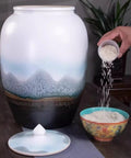 Large Ceramic Airtight Rice Container Keeps Staples Locked Tight And Grains Coffee Beans Flour And Candy Fresh As Day 50 Kilogram during rice pouring.