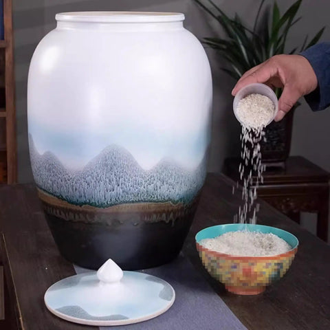 Large Ceramic Airtight Rice Container Keeps Staples Locked Tight And Grains Coffee Beans Flour And Candy Fresh As Day 50 Kilogram during rice pouring.