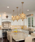 Moravian Star Light Fixture Modern Brass Seeded Glass Pendant Light for Boho Moroccan Style Rooms in a modern kitchen setting.