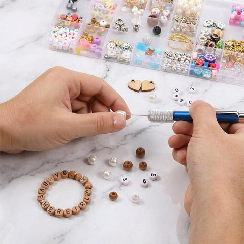 Hands using 21 Piece Micro Drill Bit Set With Pin Vise Hand Twist Drill Bits 0.3mm To 1.0mm for bead crafting.