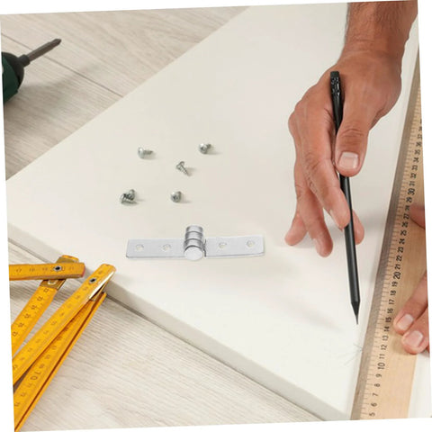 Close-up of stainless steel heavy-duty cabinet hinge mounting plate with screws on a workbench