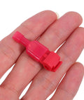 Quick Connect Spade Terminal Kit With 60 Pairs Fast Splice Wire Connectors For Soft Electrical Cables And Home Speaker Wiring Without Stripping Or Cutting Old Wires On Complex Setups Today. red insulated splice connector in hand