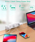 8 In 1 Desk Clamp Power Strip With 4 Outlets And 4 USB Ports Including 2 USB-C PD Fast Charge on a desk with devices connected