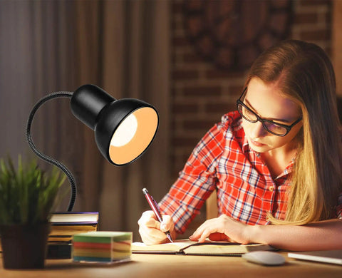 Woman studying under gooseneck clip on desk lamp with 360 degree rotation easy clip on reading light for bedroom and office.