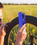 TEHAUX bike hydraulic brake hose cutter tool, blue plastic, used to cut a brake hose on a bicycle
