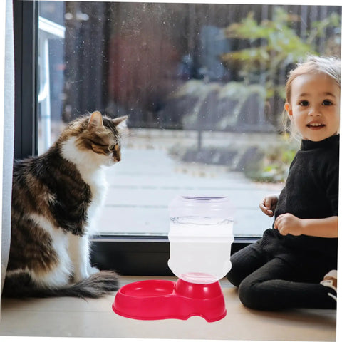 Chill Out As Your Furry Buddies Chow Down On This Pink 3.5L Automatic Pet Feeder And Water Bowl Station Featuring A Tight Leak Proof Cap And Grippy Non Slip Bottom with a cat and child.