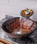 USZWBY Artistic Vessel Sink Bathroom Tempered Glass Vanity Sink, round bowl with waterfall faucet pouring water.