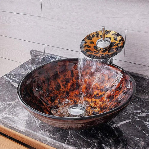 USZWBY Artistic Vessel Sink Bathroom Tempered Glass Vanity Sink, round bowl with waterfall faucet pouring water.