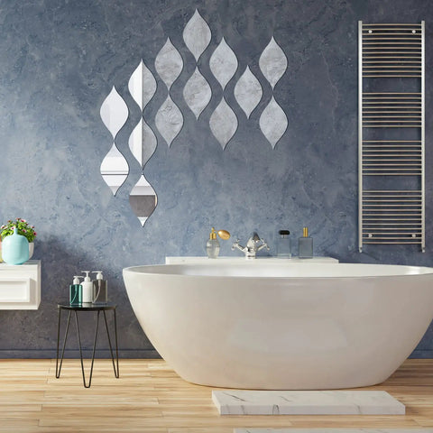 15 Pack Teardrop Mirror Wall Decals With Wavy Acrylic Finish Removable 3D DIY Art for Living Room Bathroom Home Decor 11.8 x 6.6 Inch Teardrop Silver Set displayed in bathroom over bathtub on blue wall.