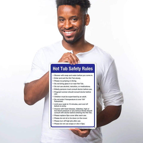 Person holding Hot Tub Safety Rules Sign For Pool Area Outdoor Durable 10x14 Inches Rust Free Aluminum Fade Resistant Made In USA