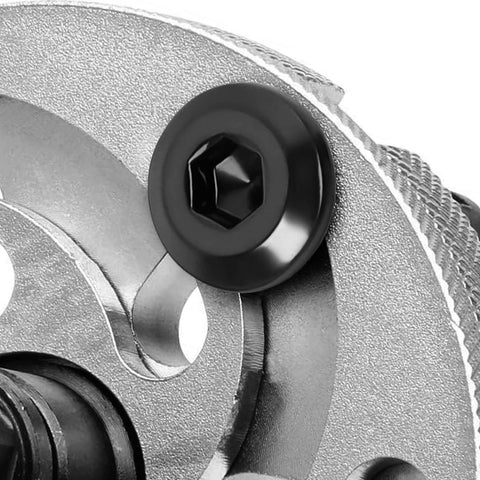 Close-up of a M6 X 16mm Flat Head Socket Cap Screw Set In Stainless Steel 304 With Black Coating, installed on metal surface.