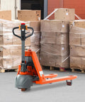 3300 Lb Electric Pallet Jack With 48 Inch Forks And Lithium Battery Powered Walking Truck for warehouse, with cardboard boxes in background.