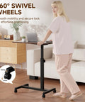 Compact Standing Desk On Wheels With Foldable 24 Inch Desktop Lockable Casters Adjustable Height in home setting