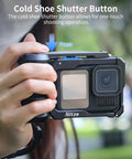 Close-up of hands holding a Street Snap Grip Kit For GoPro Hero 13 12 11 10 9 Black With Metal Cage And Ergonomic Handle outdoors.