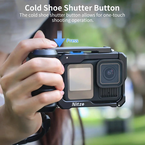 Close-up of hands holding a Street Snap Grip Kit For GoPro Hero 13 12 11 10 9 Black With Metal Cage And Ergonomic Handle outdoors.