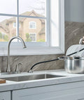 Sleek Brushed Nickel Kitchen Faucet Featuring Pull Out Side Spray Smooth Twist Valves in action while filling a pot.