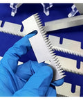 2 Pack Semi Auto Carton Sealing Knife Blade, Carbon Steel, Tape Sealer Parts For Packaging, 75X30X1.5, Beefy Wear Resistant Blade For Heavy Duty Box Sealing held in gloved hand