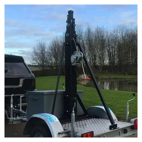 Heavy Aluminum Telescopic Winch Mast With Manual Hand Crank Extends To Nine Meters mounted on trailer for camera rig and antenna use.