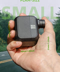 Hand holding a pocket sized mini bike pump with 100 PSI, ultra compact design, rechargeable and Presta Schrader valve compatible.