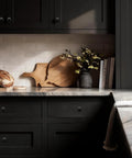 Modern Matte Black Cabinet Knobs 10 Pack 1 1/4 Inch Built Different Zinc Drawer Hardware Sleek Kitchen Cabinet Pulls on dark kitchen cabinets.