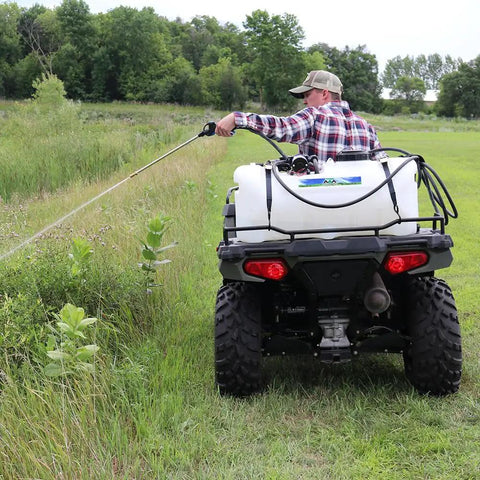 25-Gallon Deluxe UTV And ATV Spot Sprayer With 2.2 GPM Pump spraying from ATV in field