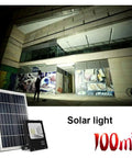 Super Bright Solar Led Flood Light Charges Quick Under Cloud Cover And Burns Flawless Dusk Till Dawn With Handy Remote Ip66 Waterproof Outdoor Security Lantern For Backyard Yard Garage Porch illuminating a building at night.