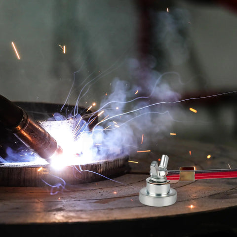 Industrial Pro Grade Magnetic Welding Grounding Clamp with slip free hold shown in action on a metal surface during welding