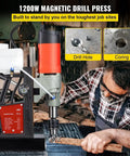Heavy Duty Magnetic Drill Press Featuring A Heavy Hitter 1200 Watt Motor And One Point Five Seven Inch Boring Range, drilling metal.