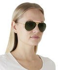 Model wearing Shooter Aviator Sunglasses, Metal Frame With Gold Blush And G-15 Green Lenses, 62mm, Prescription Ready, Case Included