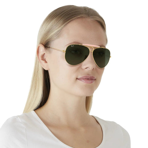 Model wearing Shooter Aviator Sunglasses, Metal Frame With Gold Blush And G-15 Green Lenses, 62mm, Prescription Ready, Case Included