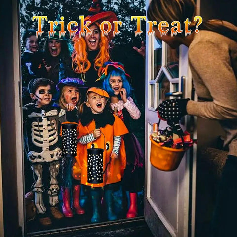 Children in Halloween costumes holding lanterns, accompanied by an adult handing out candy at the door.