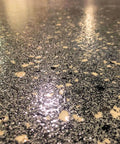 Ultra Tough Polyaspartic Concrete Coating With Bulletproof Abrasion And Chemical Resistance Delivers High Gloss Sealer Protection Zero VOC Formula For Fast Cure And Epic Garage Floors 3 Quart Kit on a shiny black surface.