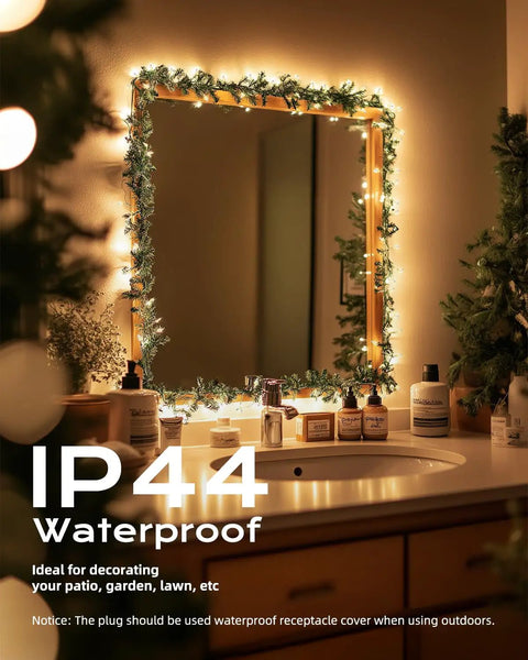 Bathroom mirror decorated with Clear Incandescent Mini Christmas Lights 100-Count On 20 Ft White Wire End-To-End Connectable