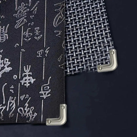 Close-up of 12 Pack Slick Metal Handbag Corner Protectors With Shiny Electroplated Finish for Purses, showing on black textured material.