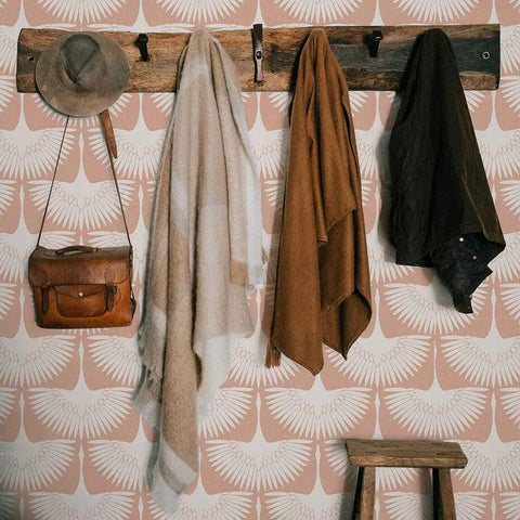 Cozy entryway with Genevieve Gorder Sahara Blush Feather Flock Peel and Stick Wallpaper, pink bird pattern backdrop.