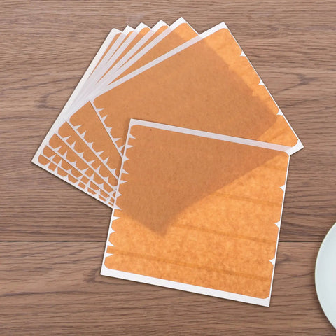 Sheets of Beefy Heavy Duty Packing Tape For Cardboard Boxes With High Adhesion And Easy Tear Strip on wood surface.