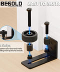 Bottom Adjustable Barn Door Floor Guide Kit with wall rollers; black carbon steel, showing installation with felt strips.