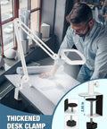 Man using 12X Magnifying Glass With Light And Stand on desk, focusing on design work with thickened desk clamp attachment.
