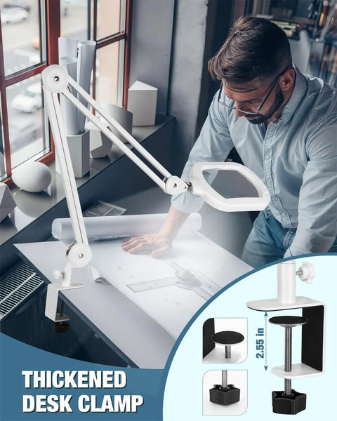 Man using 12X Magnifying Glass With Light And Stand on desk, focusing on design work with thickened desk clamp attachment.