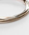 Close-up of coiled 12 Gauge 925 Sterling Silver Wire Dead Soft Square Made In USA 5 Ft for DIY jewelry making and wire wrapping projects.