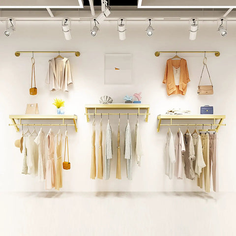 Top Shelf Wall Mounted Clothing Rack System Kit Crafted from Rock Solid Wrought Iron Pipes and Rugged Pine Boards for Boutique or Main Street Closets That Can Take Some Serious Wear and Tear, displaying outfits on a stylish setup.