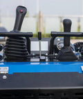 Controls of a Compact Skid Steer Loader With Crawler Tracks And Wear Resistant Bucket For Easy Operation In Urban Streets Homes