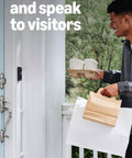 A man using Top Shelf Hardwired Video Doorbell Camera with Flawless 1080p HD Streaming to greet delivery at home.