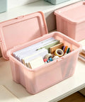 Sick Space Saver Pink Plastic Storage Bin Knocking Clutter Out With 18 Gallon Stackable Tote filled with office supplies.