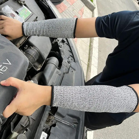 Cut Resistant Arm Sleeves With Level 5 Protection And 10 Inch Length For Work worn by person working on car engine
