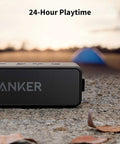 Beefy Bass Portable Bluetooth Speaker With Crisp Stereo Sound, IPX7 Waterproof, shown on ground next to fallen leaves