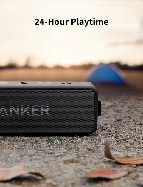Beefy Bass Portable Bluetooth Speaker With Crisp Stereo Sound, IPX7 Waterproof, shown on ground next to fallen leaves