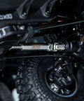 Heavy Duty Stainless Steel Drive Shafts For Fms Fcx10 K5 1 10 Scale Rc Crawler showing reinforced axle and tire detail.