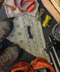 Camping scene featuring Six Point One Inch Lightweight EDC Folding Knife With Stainless Steel Blade USA Made on patterned cloth